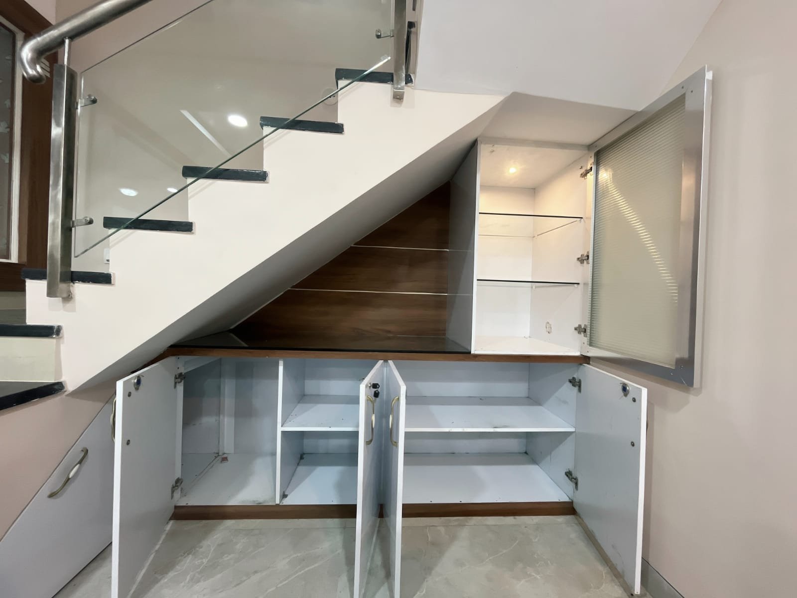 Under-stair storage with shelves open